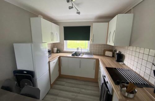 Scurlage Ski Chalet | 2 Bed Bungalow -25 Gower Holiday Village - Dog Friendly