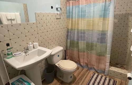 Spanish Town Zone House | 2 bedrooms, 1 bathroom, kitchen, WiFi, and AC in Greendale, Spanish Town.