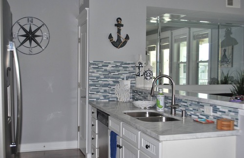 Red Fish Cove Condo | Beachfront, top floor condo steps away from Pointe West Beach Club and beaches.