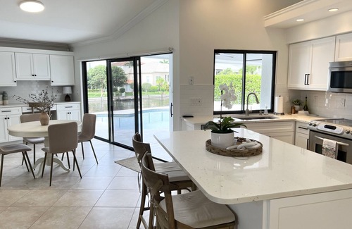 Connors House | Beautiful home on canal w/pool, walking distance to Vanderbilt Beach