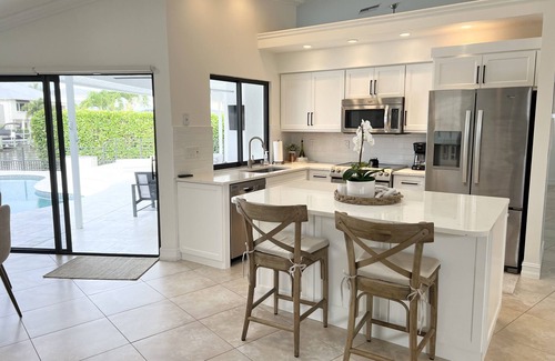 Connors House | Beautiful home on canal w/pool, walking distance to Vanderbilt Beach
