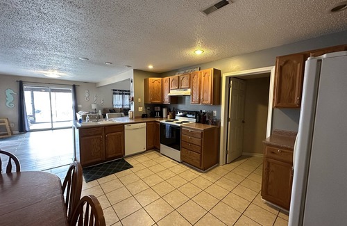 Marion House | Best location! Next door to full service marina and bar/restaurant.