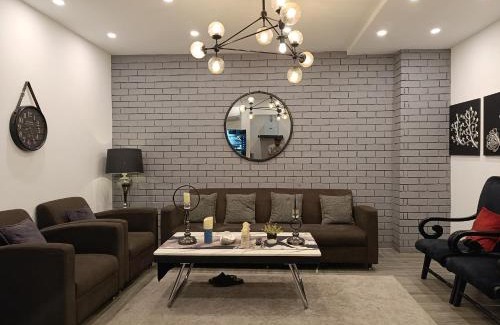 Bahria Town Apartment | Brick Accent Loft 1BHK with Balcony & Free Netflix