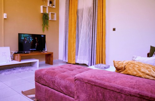 Yaounde Apartment | Bright, cozy apartment, where mustard yellow creates a warm ambience.