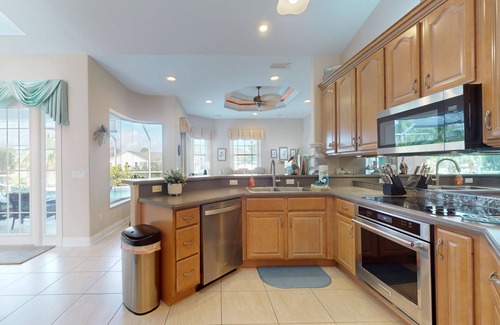Palm Harbor House | Canalfront Home with Private Pool, High-Speed WiFi, Central AC, and Dock!