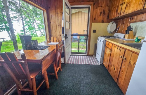 Indian River Cottage | Charming lakefront cottage with large yard, dock, & fire pit - close to downtown
