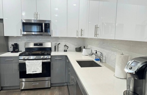 Communipaw Apartment | Chic 2 bedroom apartment with Rooftop views of NYC
