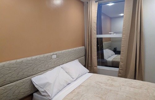 Iligan House | Cozy 1-bedroom hotel in superb Iligan City with AC, WiFi