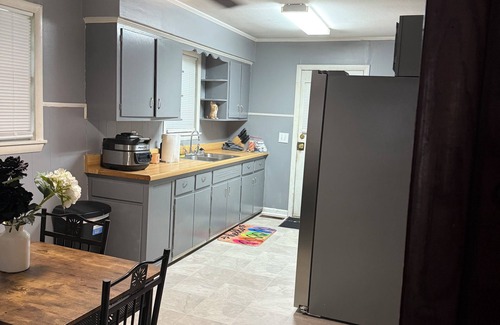 Piggott House | Cozy 3-Bedroom Cottage with Carport & Shaded Yard. Nestled under a big tree.