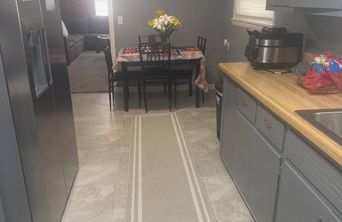 Piggott House | Cozy 3-Bedroom Cottage with Carport & Shaded Yard. Nestled under a big tree.