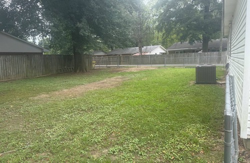 Piggott House | Cozy 3-Bedroom Cottage with Carport & Shaded Yard. Nestled under a big tree.