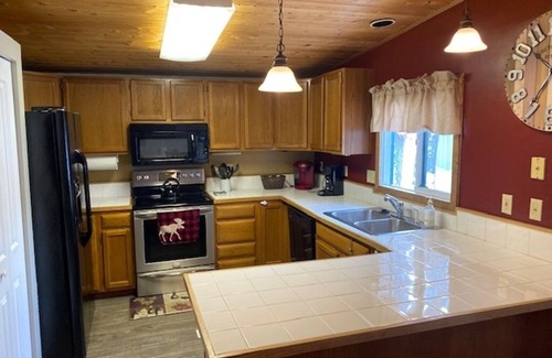 Red Lodge Cabin | Cozy Getaway in Town! Enjoy Rock Creek Flowing Just Steps from Wrap Round Deck