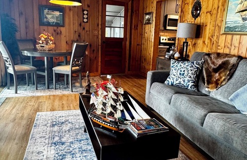 Newaygo Cottage | Cozy Waterfront Cottage - 2 private docks, kayaks, pedal boat, grill & firepit!