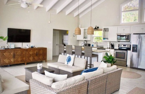 Johnson Bay Villa | Discover the Rainbow Beach House – your ultimate beachfront getaway in stunning Coral Bay! Experience the perfect blend of comfort and relaxation in this idyllic paradise. Book your escape today!