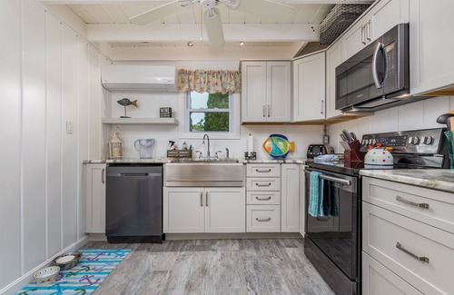 Rehoboth by the Sea Cottage | Enjoy the screened in porch just steps from the beach.