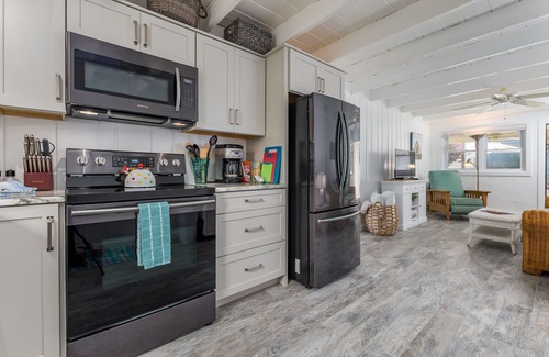 Rehoboth by the Sea Cottage | Enjoy the screened in porch just steps from the beach.