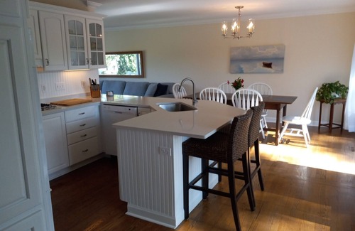 Powers Lake House | Enjoy this updated home just steps from the sandy beach in Powers Lake.