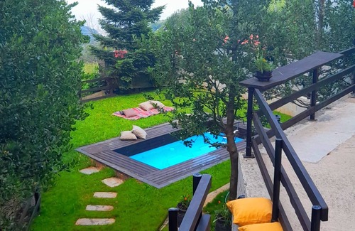 Anilio Villa | Golden Mountain in Anilio Pelion has an outdoor swimming pool and a garden