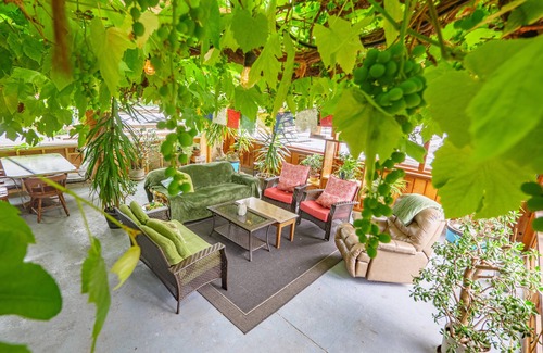 Ucluelet House | Grapevine Guest House. A west coast home featuring a 25 year old grapevine.