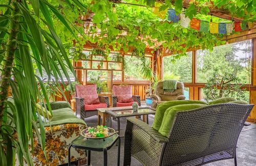 Ucluelet House | Grapevine Guest House. A west coast home featuring a 25 year old grapevine.
