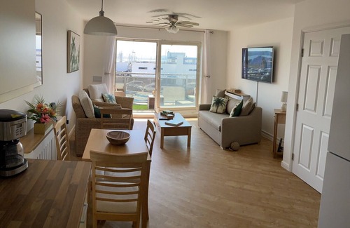 Hamworthy Apartment | Harbour Lights sea and beach views with a Caribbean-style and secure parking
