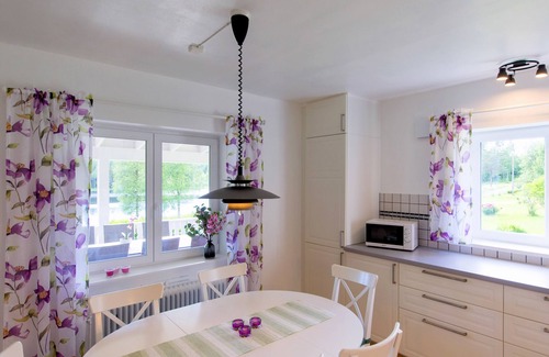 Axland House | Idyllic sunny lakeside location with only 20 m to the private jetty and boat.