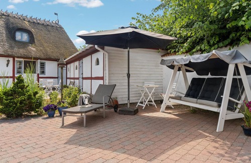 Bog By House | In the heart of Bogø Island, this beautiful thatched house welcomes you with authentic charm.