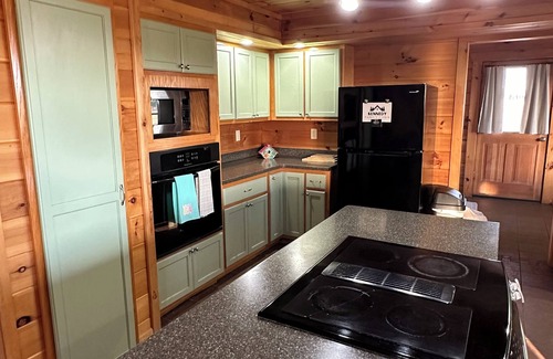 Toombs County Cabin | Kennedy Family Cabin- a large log cabin in a rural, farming community