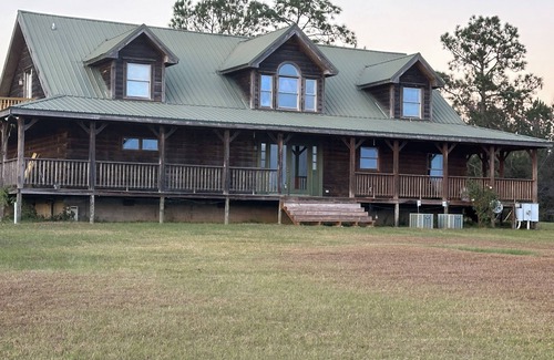 Toombs County Cabin | Kennedy Family Cabin- a large log cabin in a rural, farming community