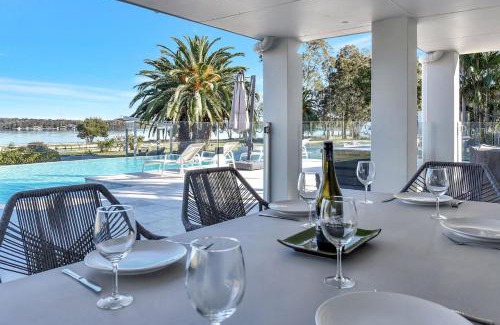 Dora Creek House | Lake Palm Resort Luxury Retreat absolute Waterfront on 3 acres at Lake Macquarie.