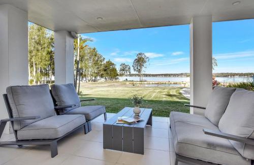 Dora Creek House | Lake Palm Resort Luxury Retreat absolute Waterfront on 3 acres at Lake Macquarie.