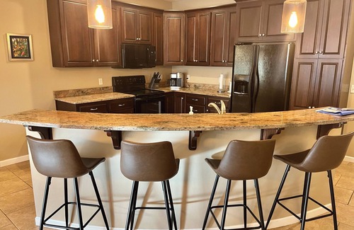 Arnolds Park Condo | Lake view condo! Updated unit with 8 beds and 6 waterpark passes at Bridges Bay.
