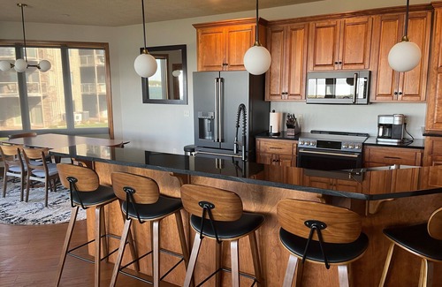 Arnolds Park Condo | Lakefront BB Corner Condo.nExpanded deck & panoramic views & 6 waterpark passes.