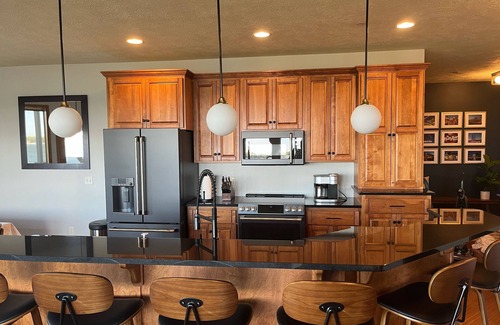 Arnolds Park Condo | Lakefront BB Corner Condo.nExpanded deck & panoramic views & 6 waterpark passes.