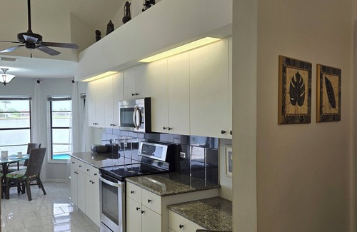Pelican House | Lakefront Luxury Paradise: 80ft Waterfront, Private Pier & Heated Pool Oasis!