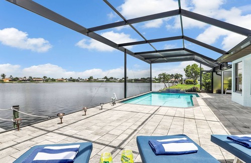 Pelican House | Lakefront Luxury Paradise: 80ft Waterfront, Private Pier & Heated Pool Oasis!