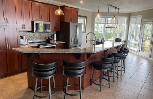Arnolds Park Condo | Lakefront Luxury! Spacious corner condo, wrap around deck. 6 BB waterpark passes