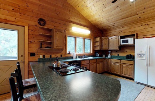 Greenville Junction Cabin | LogHome on Moosehead Lake w/Seasonal Dock, Pebble Beach, Firepit & Spacious Deck