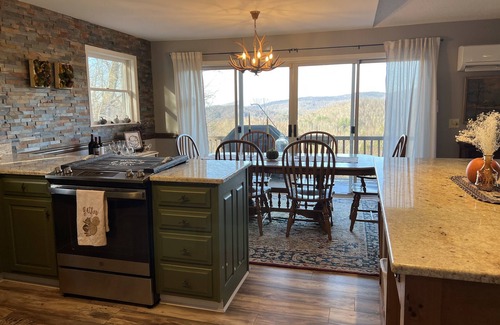 Frank House | Long range views. Sleeps 10! Hot tub, game tables and close to everything!