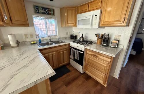 Smith River House | Modern Ocean Cabin 27 Stylish Kitchen & Jacuzzi