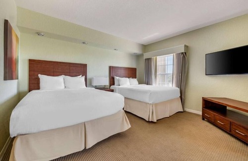 West Kissimmee Hotel | Moments from Theme Parks! Outdoor Pool, Full Kitchen, Free Shuttle!