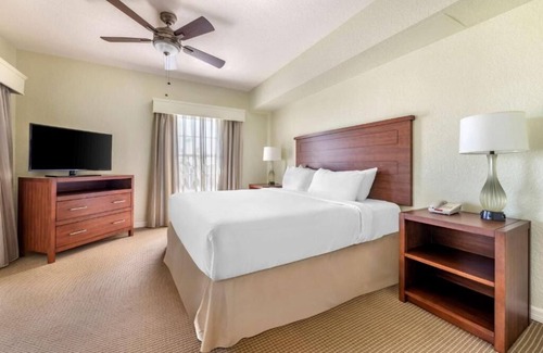 West Kissimmee Hotel | Moments from Theme Parks! Outdoor Pool, Full Kitchen, Free Shuttle!