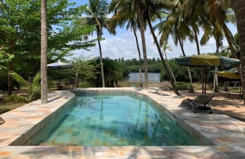 Ouidah Villa | Natura luxury red house