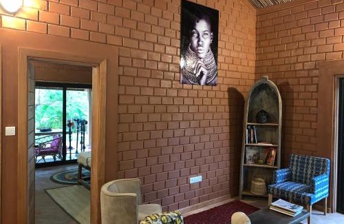 Ouidah Villa | Natura luxury red house