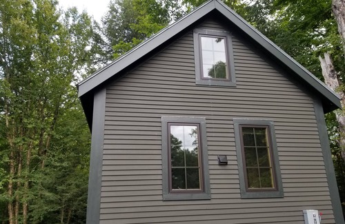 Craftsbury Cabin | Northwoods Guest Cabin & porch overlooking private woods and stream