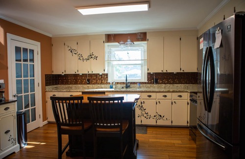 Wilmington House | Oasis in the middle of town for large groups with pool and 2 Master bedrooms.