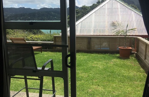 Whangaroa Ski Chalet | One Bedroom Unit with bathroom and small living area with kitchenette.