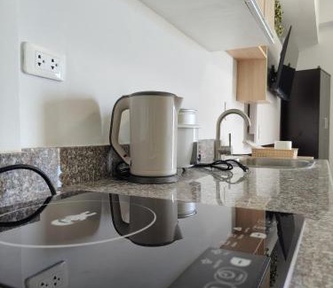 Mactan Export Processing Zone Apartment | OVERTIME STAYCATION - Nearest to Airport with FREE POOL & GYM ACCESS