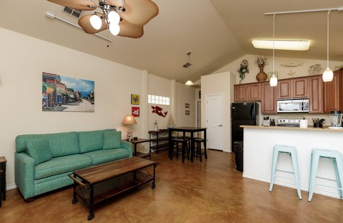 Corpus Christi Cottage | Pet-Friendly Retreat w/a Private Patio, Tropical Pool, & in a Great Location!