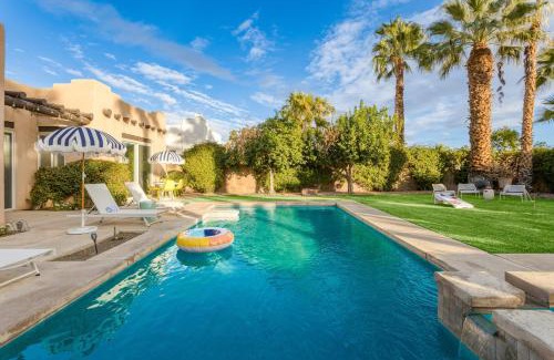 Bermuda Dunes House | Pool Hot Tub Yard Games Chic Midcentury Design Painted Sand by AvantStay